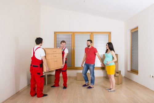 Local removals team working in Tufnellpark street with a moving van